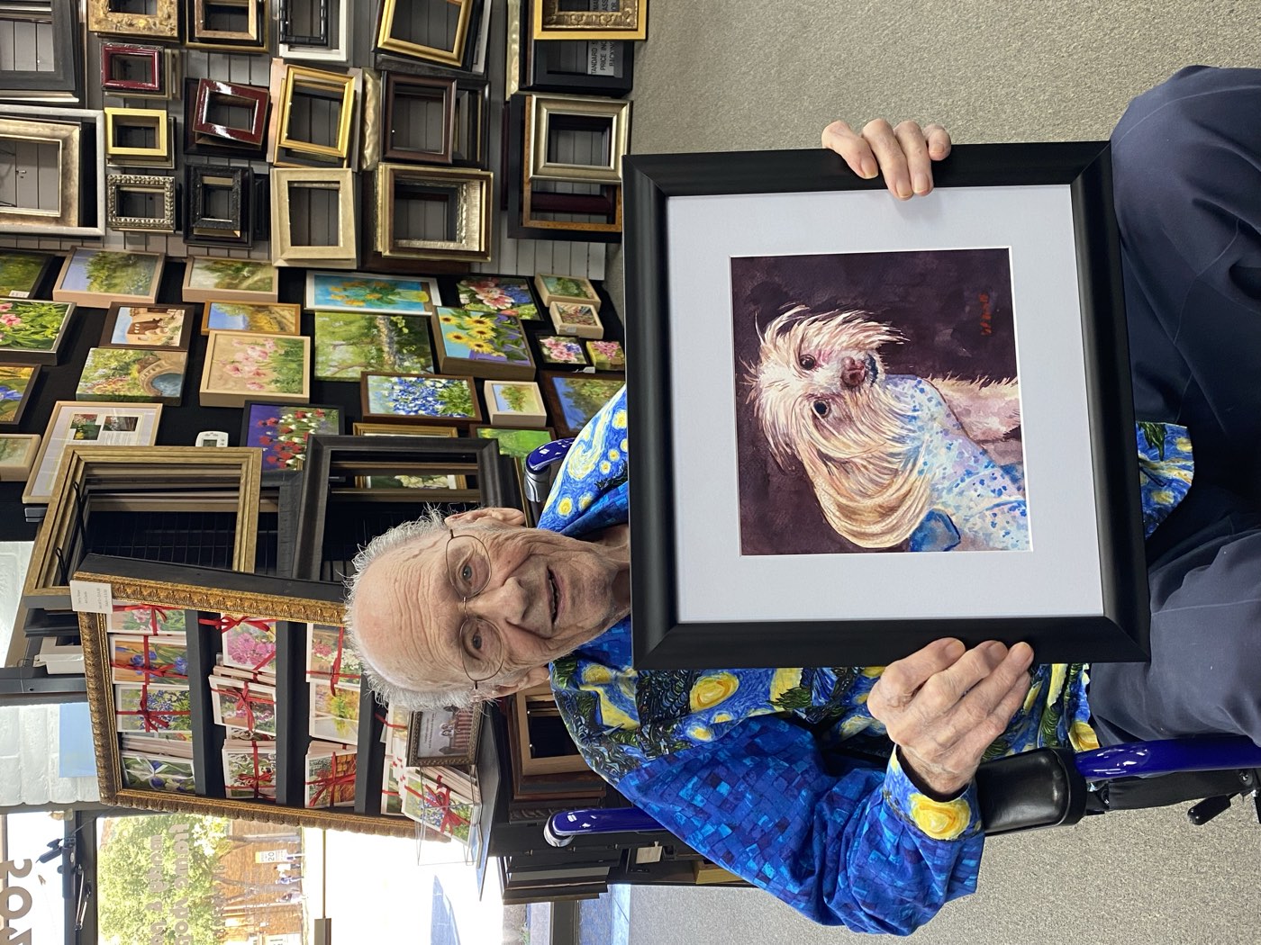 Custom-framed pet portrait finished at the Fort Worth frame shop